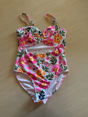 Girl's Floral Swimsuit size 12 years like new, colorful with cut-out