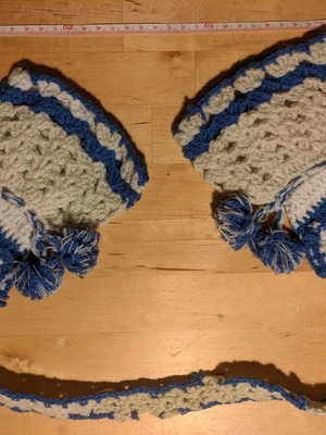 Knitted pot holders used in the shape of a women's dress