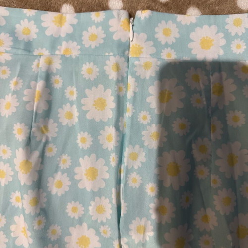 Mini skirt with daisies on blue background, size S, like new