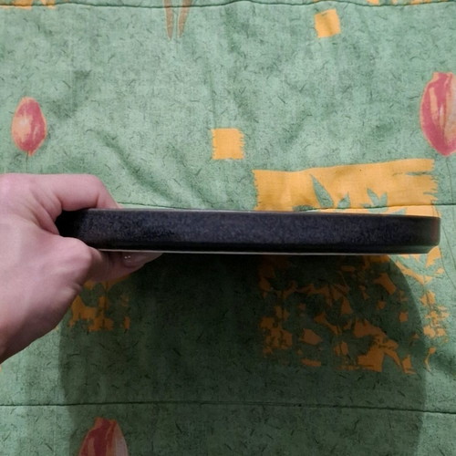Porcelain plate used, black with small chip