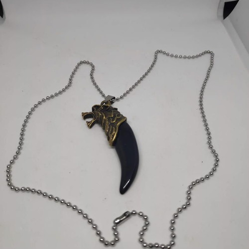 Necklace with wolf tooth pendant like new, gold and black