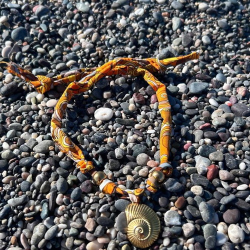 Summer necklace with steel elements on fabric strip