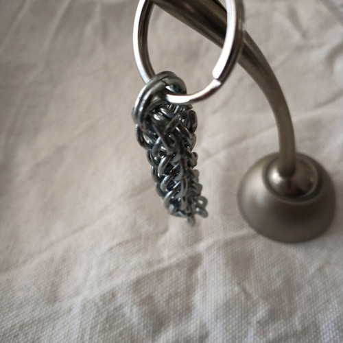 Steel keychain like new, Persian knot