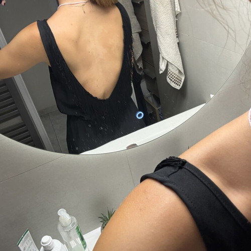 Pink Woman black jumpsuit with open back