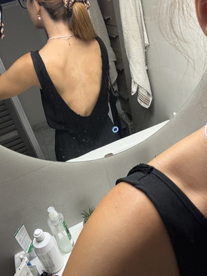 Pink Woman black jumpsuit with open back