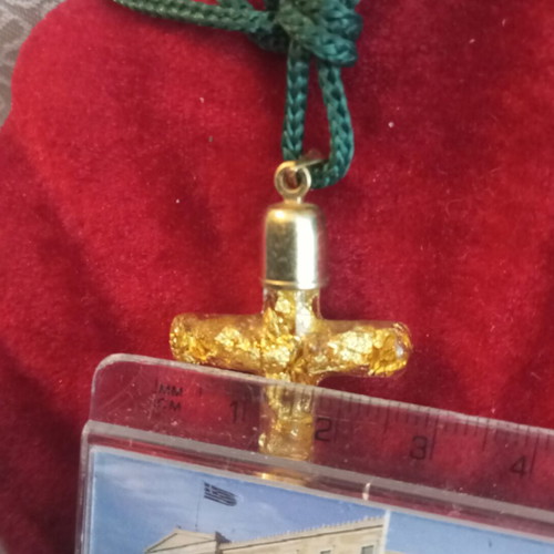 Cross with pure gold leafs in solution, metal