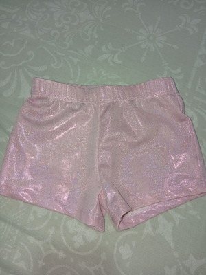 Girls' sports shorts size 4Y in shiny pink, like new