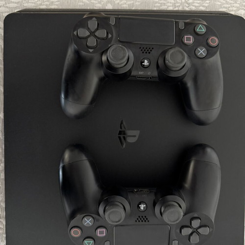 PlayStation 4 Slim 500GB like new with 2 controllers and 2 games