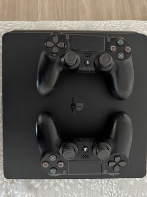 PlayStation 4 Slim 500GB like new with 2 controllers and 2 games
