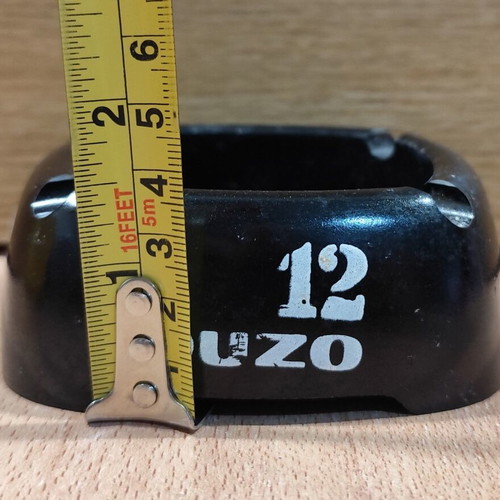 Ouzo 12 square black plastic ashtray used