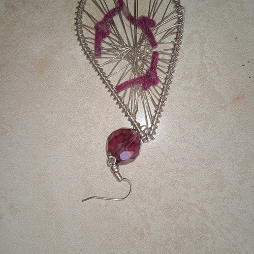 Handmade earrings used with wire and amethyst-colored bead