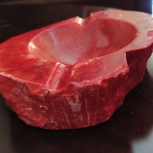 Large ashtray used red with veins