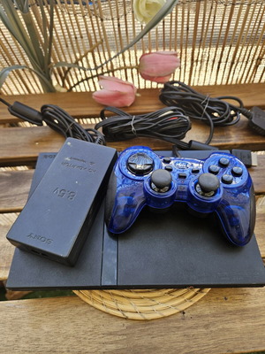 Sony PlayStation 2 Slim console bundle with blue controller and power adapter
