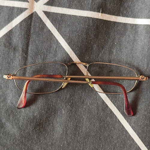 Vogue eyeglass frame used, gold color