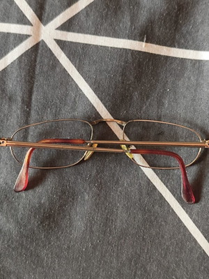 Vogue eyeglass frame used, gold color