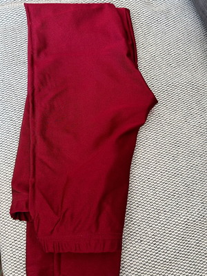 Long burgundy shiny leggings used, size M