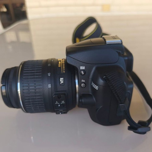 Nikon D3000 camera with AF-S 18-55mm f/3.5-5.6 lens and bag