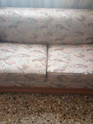 Two-seater sofa bed with wooden frame and rattan sides