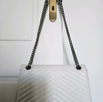 White shoulder bag with zipper and inner pockets