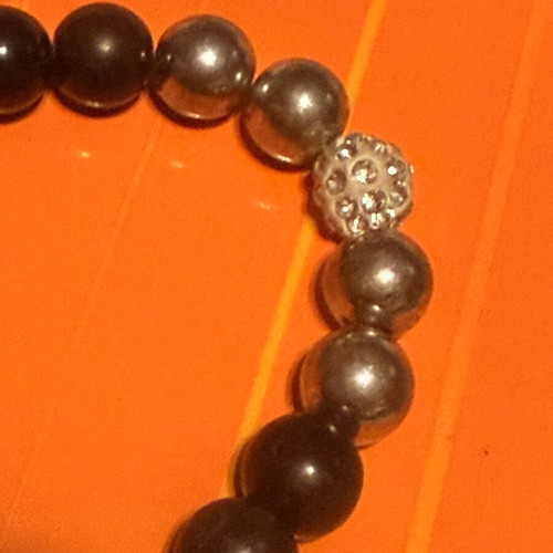Elastic bracelet like new with steering wheel and turtle charms black-silver