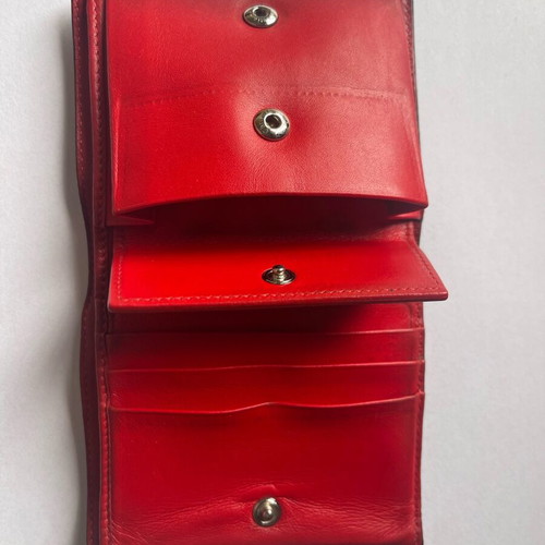Christian Louboutin wallet used with missing spike and black stains