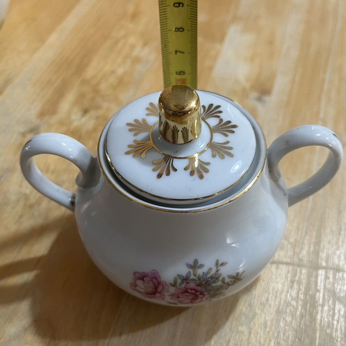 Porcelain tea set used with floral pattern, teapot, creamer, sugar bowl