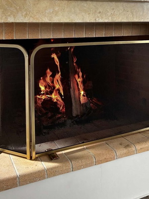 Fireplace screen trifolding with tool set used