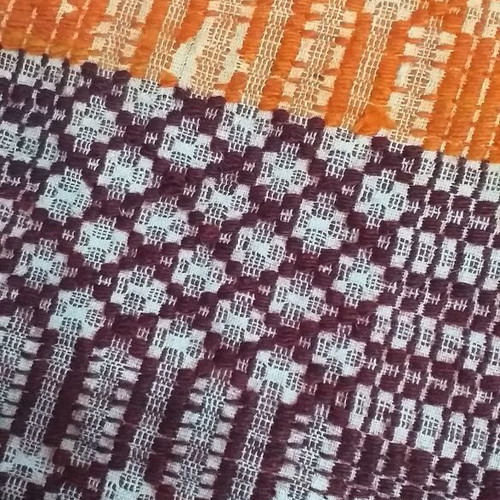 Old warp-weighted loom pillow used, very old with wear