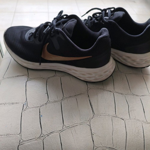 Nike shoes size 38.5 used, black with gold logo, athletic