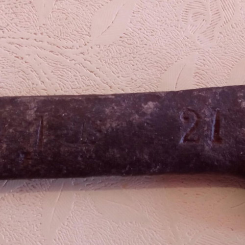Old wrench with worn numbers and codes used