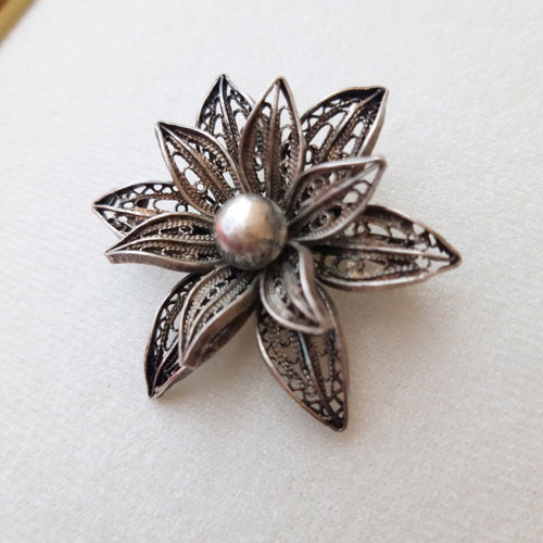 Silver filigree brooch used, flower design