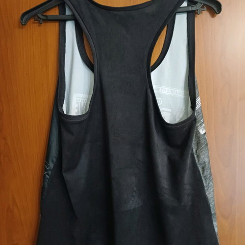 Iso sleeveless women's top rock style like new, black and white, size M