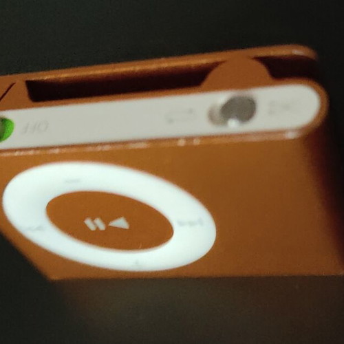 Apple iPod Shuffle 2nd Gen orange with dock, cable and headphones used
