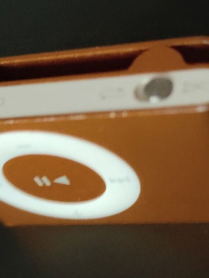 Apple iPod Shuffle 2nd Gen orange with dock, cable and headphones used