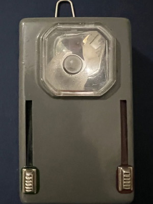 Vintage tin flashlight with filters and paper in battery compartment new