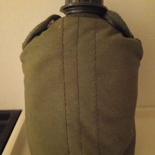 Plastic military canteen with case used