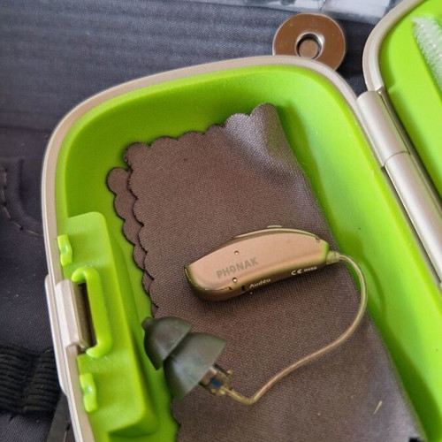 Phonak Audéo V hearing aid with case and cleaning accessories