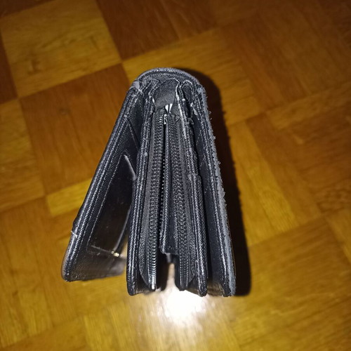 Black wallet slightly used with multiple compartments