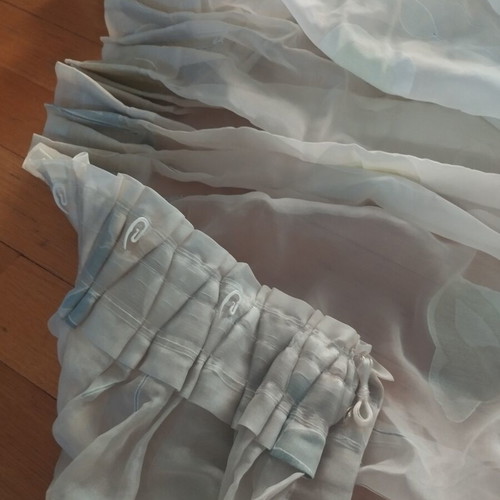 Semi-transparent curtain with soft floral patterns