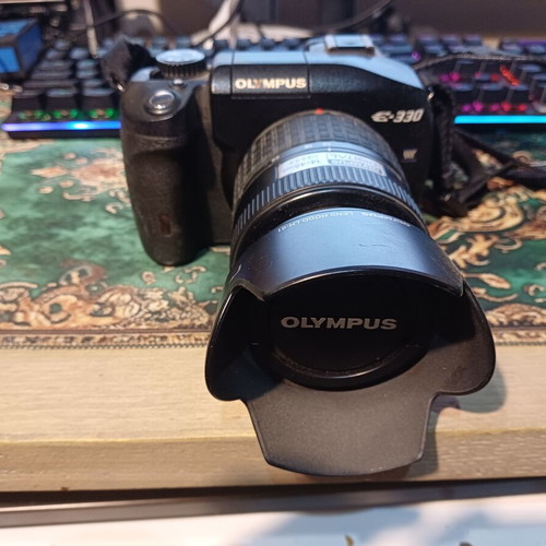 Olympus E-330 DSLR camera used with Zuiko Digital 14-45mm lens