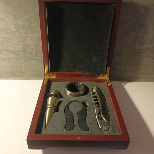 Bottle opening set in rosewood case