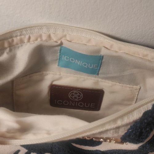 Iconique clutch bag new, white with dark blue leaves