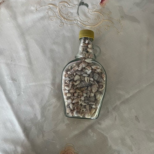 Glass vase filled with natural shells made to order