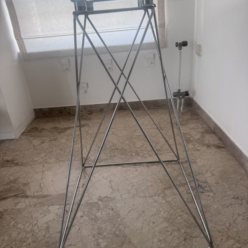Round glass dining table used with silver detailing 100x76