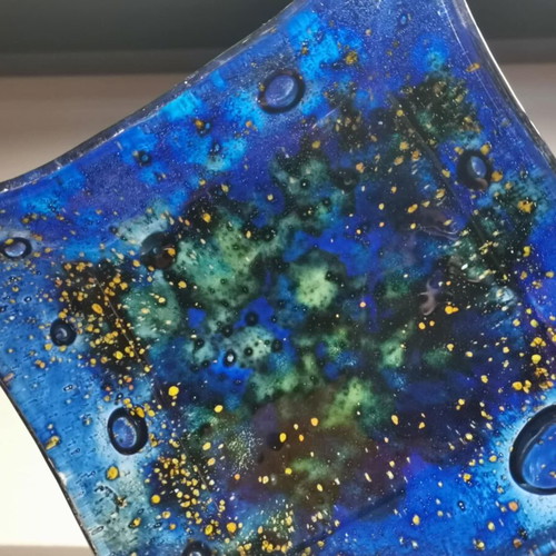 Decorative plate used, blown glass blue with green and yellow elements