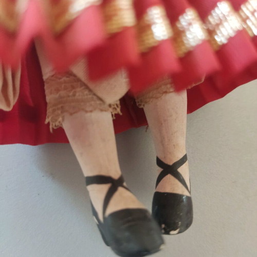 Vintage doll used with porcelain head and embroidered apron