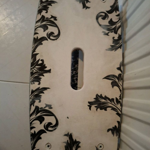 Footstool used with black and white decoupage technique