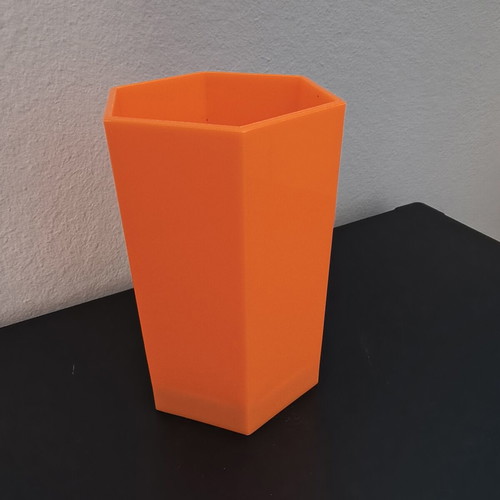 Hexagonal orange pencil holder like new, plastic