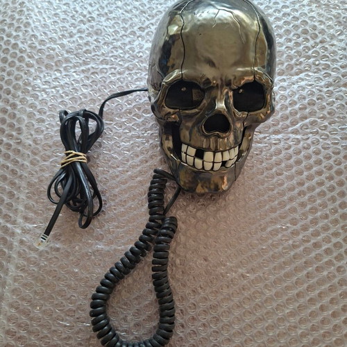 Decorative skull-shaped phone used, wired