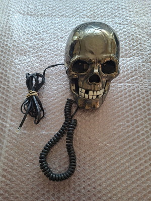 Decorative skull-shaped phone used, wired
